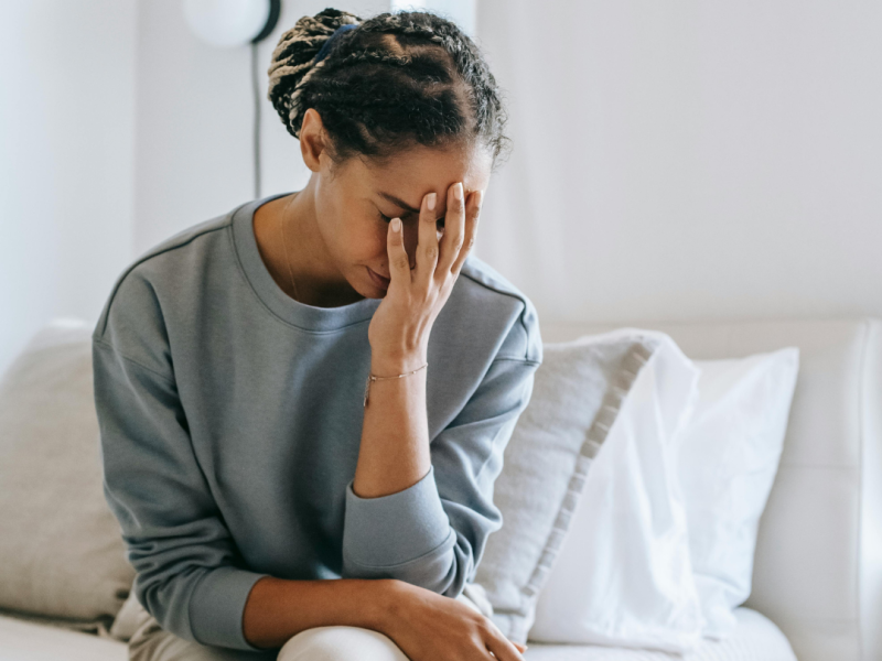 women unsure she is pregnant, looks anxious and unsure what to do next