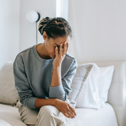 women unsure she is pregnant, looks anxious and unsure what to do next